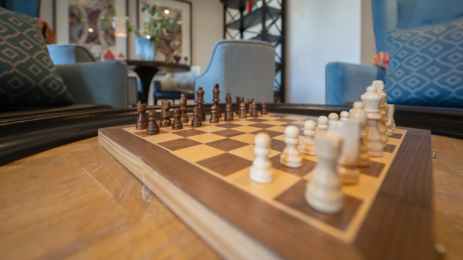 Close-up of a chess game in a common area.