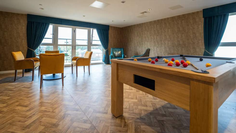 Recreation room with a pool table and seating area