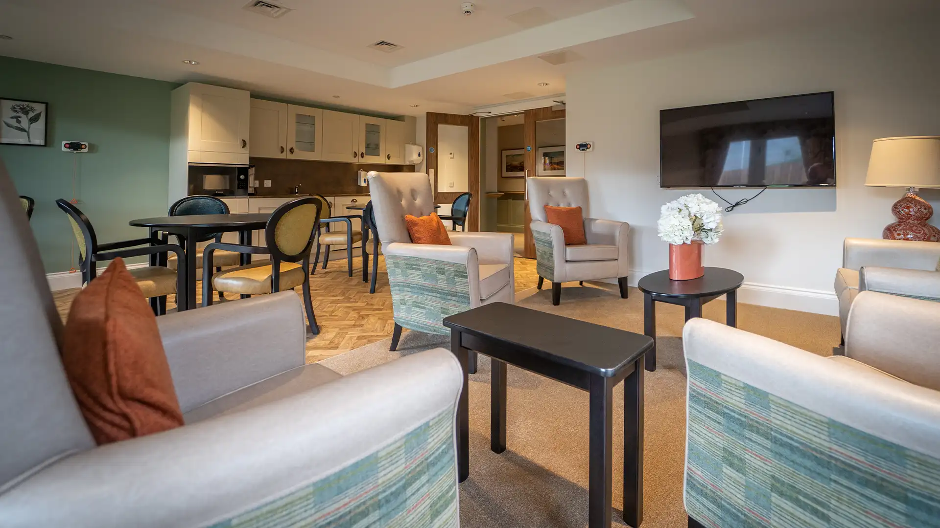 Cozy common area with seating and a TV