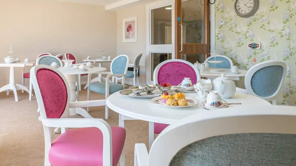 Cozy dining area with tea and pastries