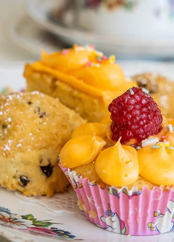 Close-up of decorative cupcakes and pastries.