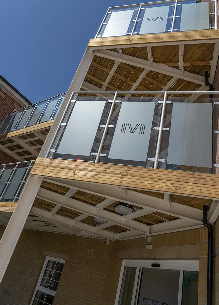 Exterior view of a multi-level building with balconies.
