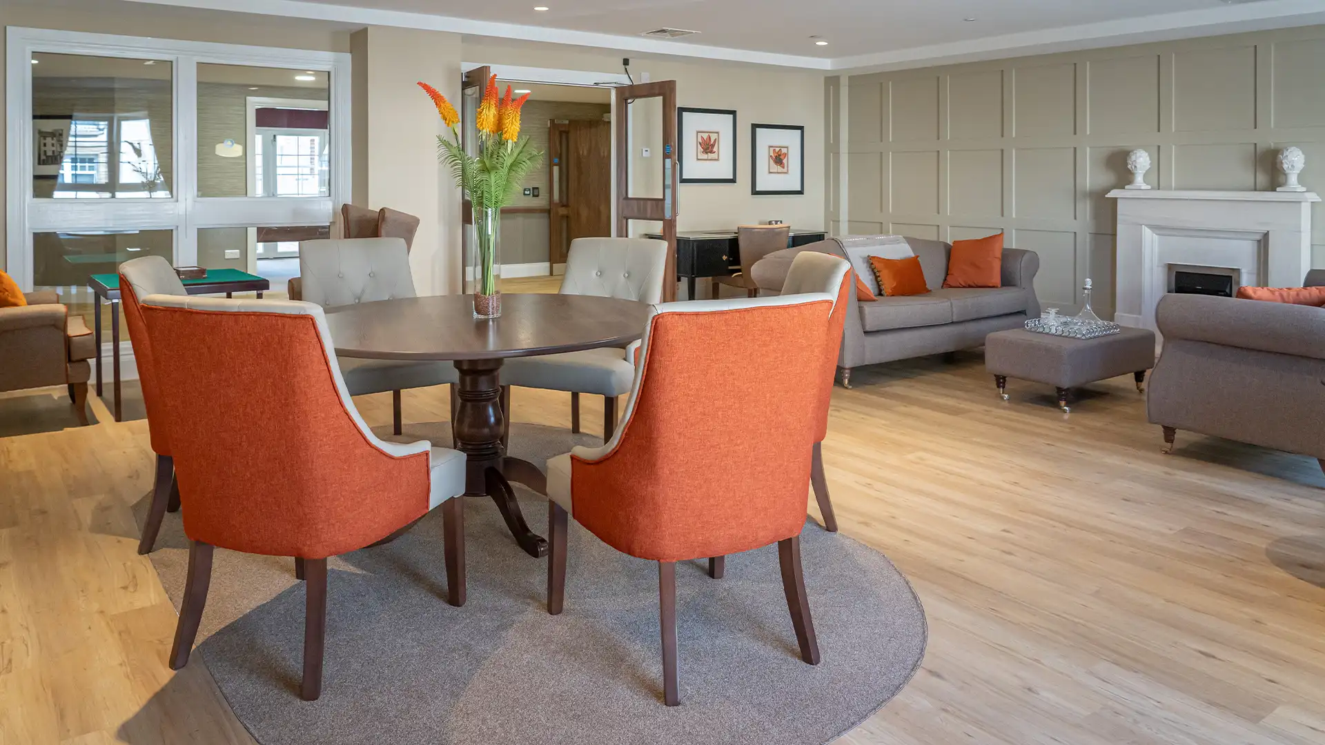 Lounge area with comfortable seating and decorative plants.