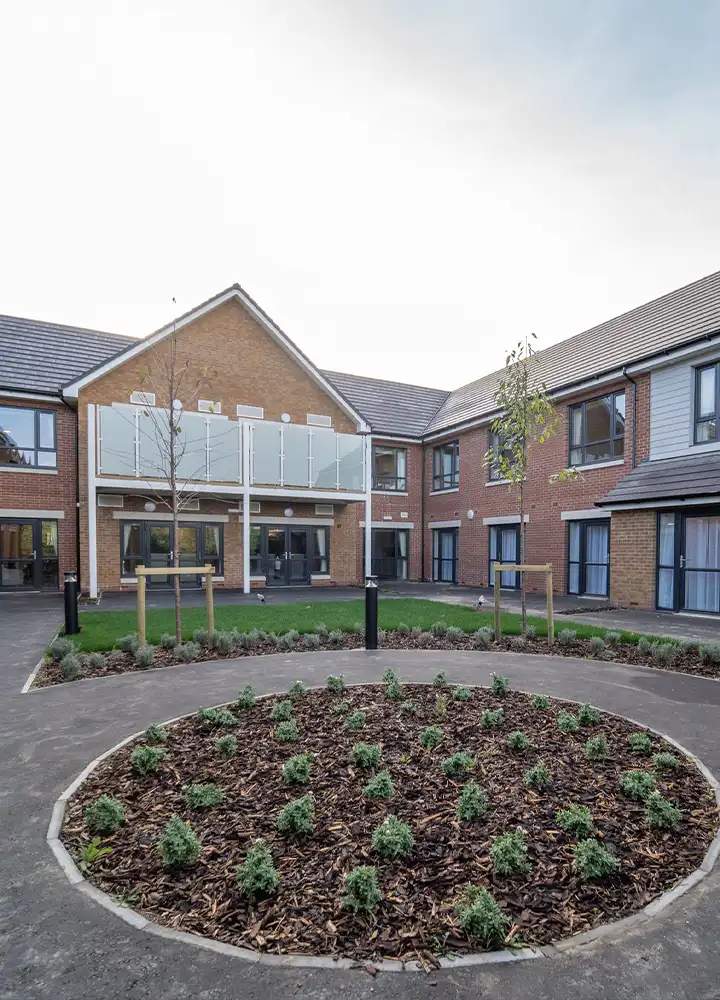 Courtyard with landscaping and building backdrop.