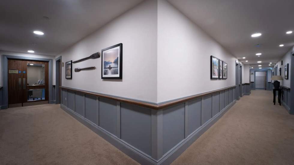 Interior hallway with framed photos and decor