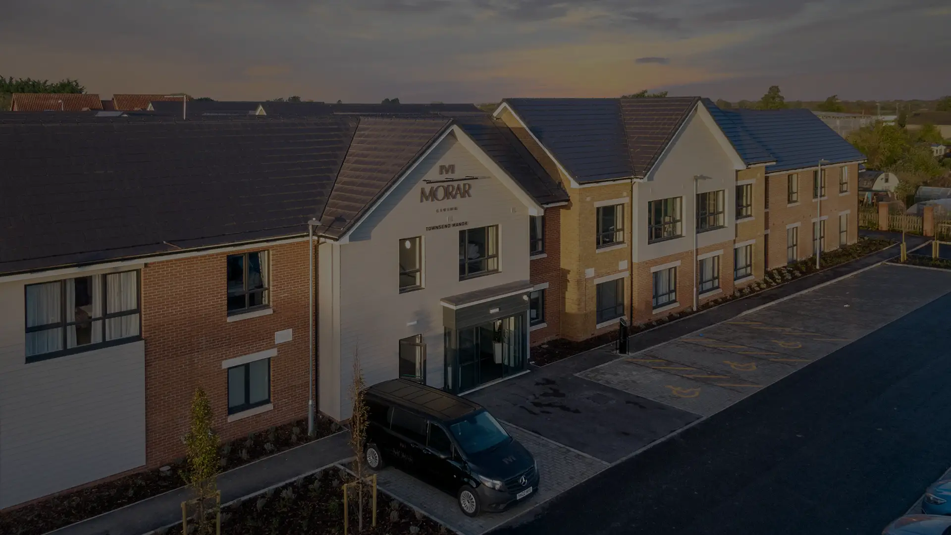 Exterior view of Escan Manor building