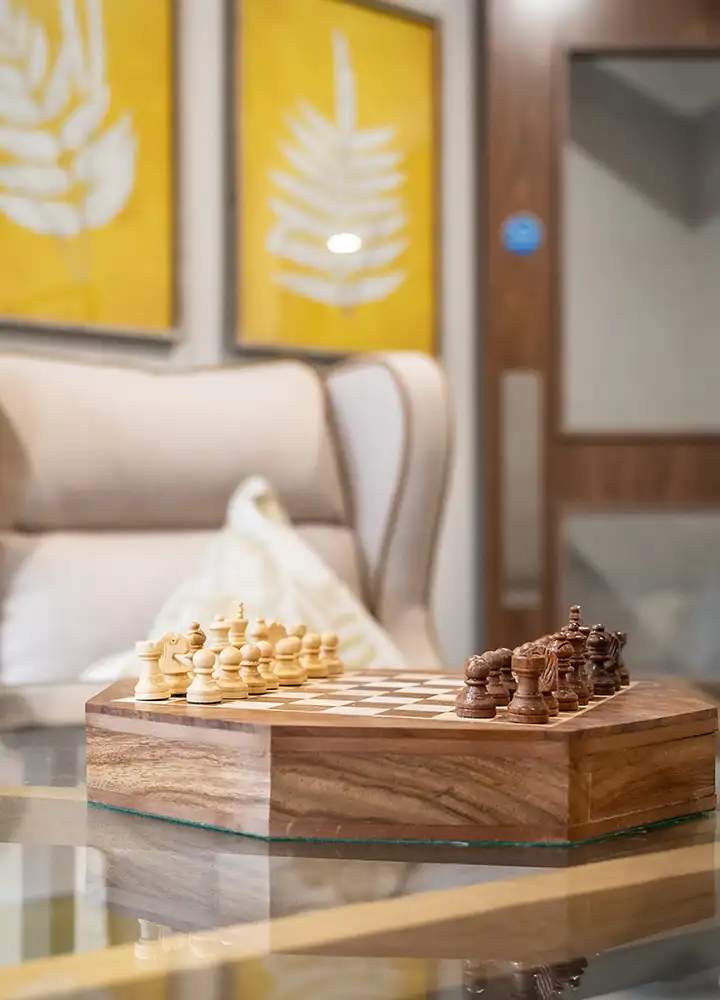 Chess set on a table in a cozy lounge area