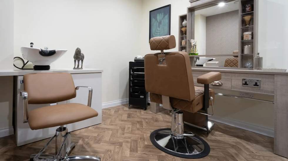 Modern hair salon area with styling chairs