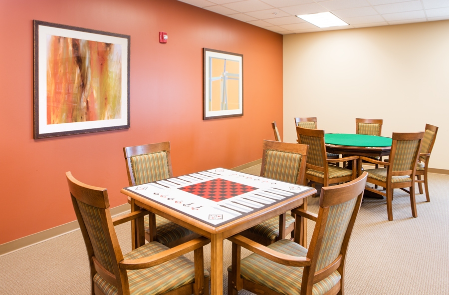 Common area with tables and chairs for activities