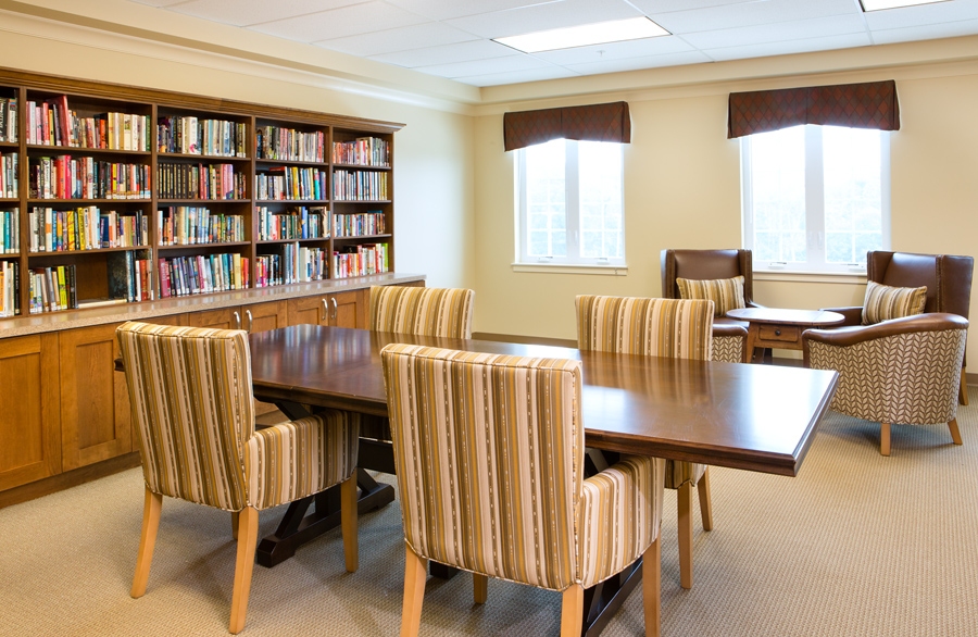 Cozy library area with bookshelves and seating