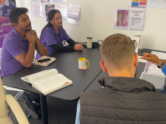 Staff members in a meeting at a table