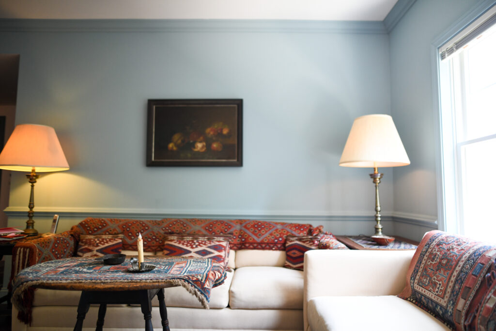 Cozy living room with patterned sofas and lamps