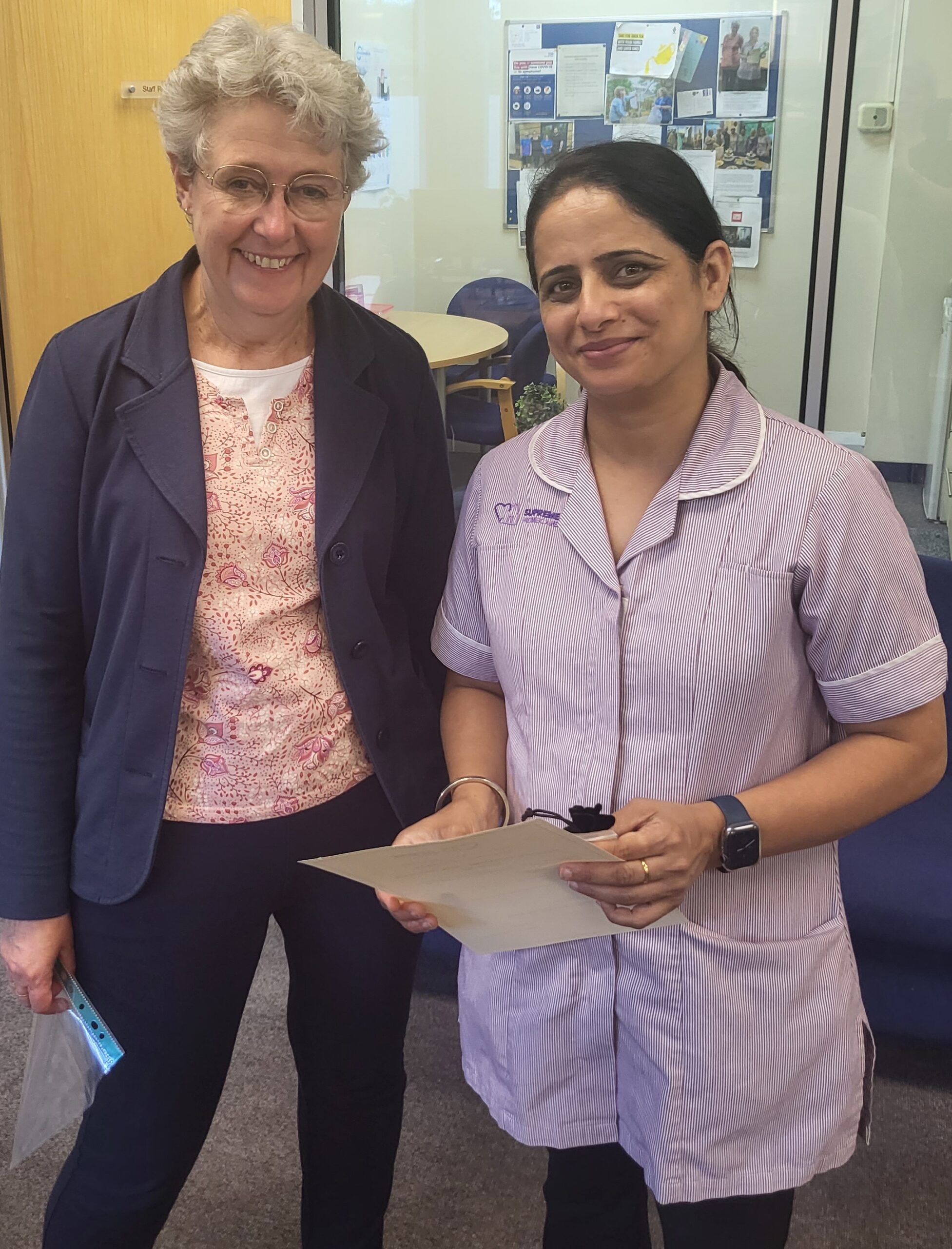 Staff member with a resident in a common area