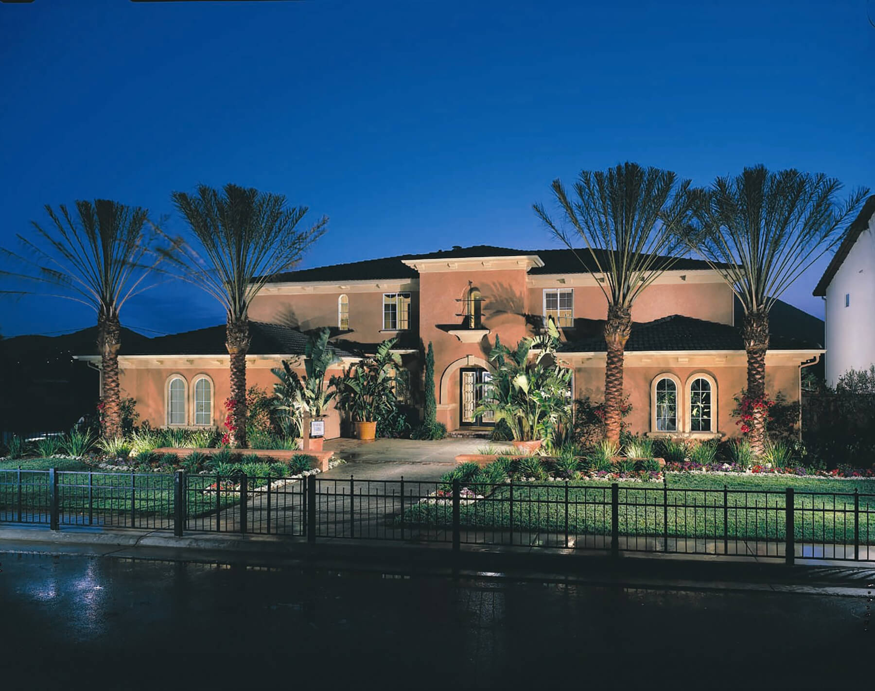 The exterior of a well-lit facility at night