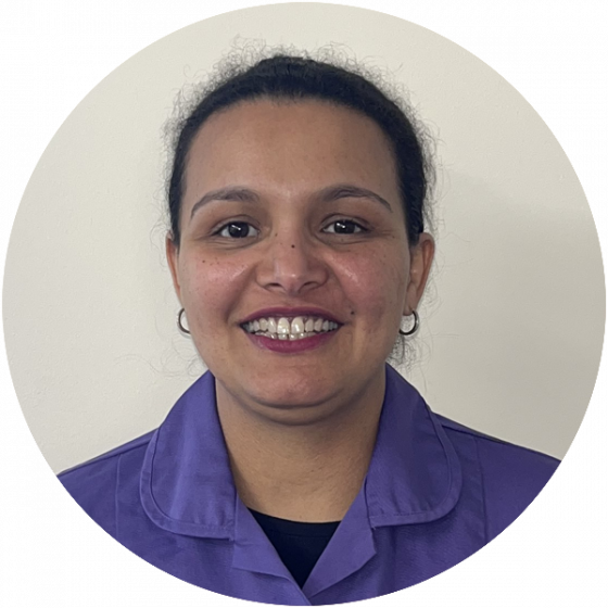 Staff member smiling in uniform