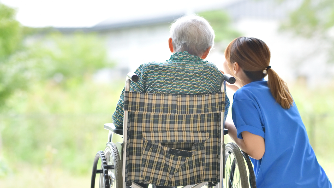 Resident and staff enjoying time outdoors