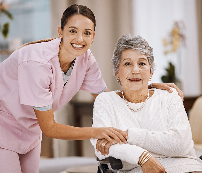 Staff member with a resident in a cozy interior