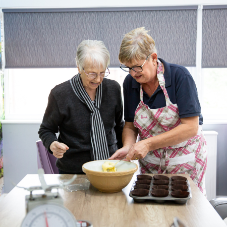 Residents engaged in baking activity.
