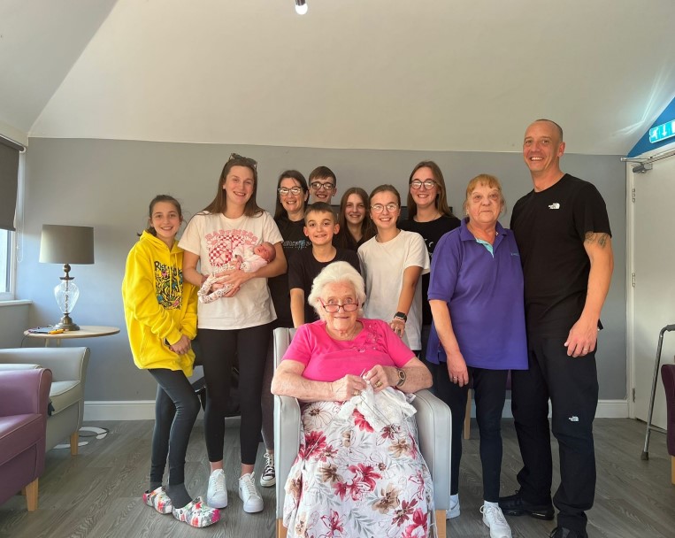Residents and family members enjoying a group photo