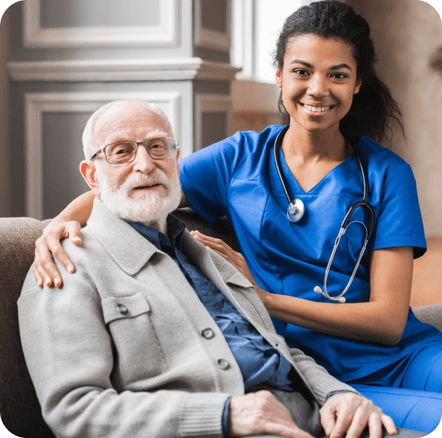 A caregiver and resident smiling together.