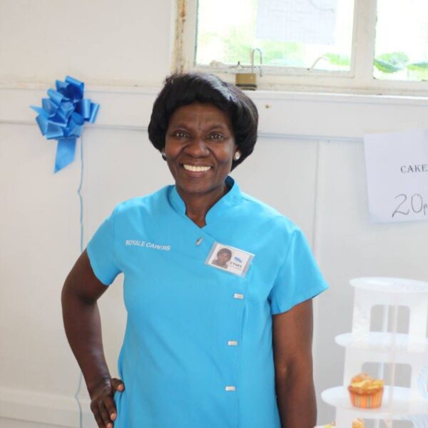 Staff member smiling at celebration event.