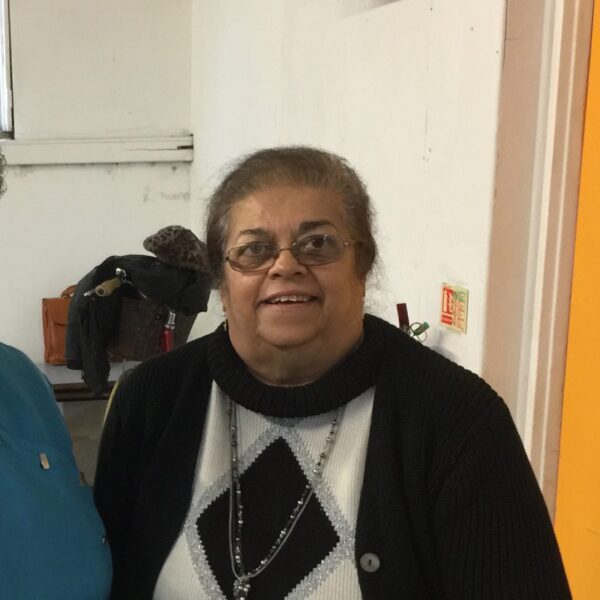 Resident smiling in an indoor setting