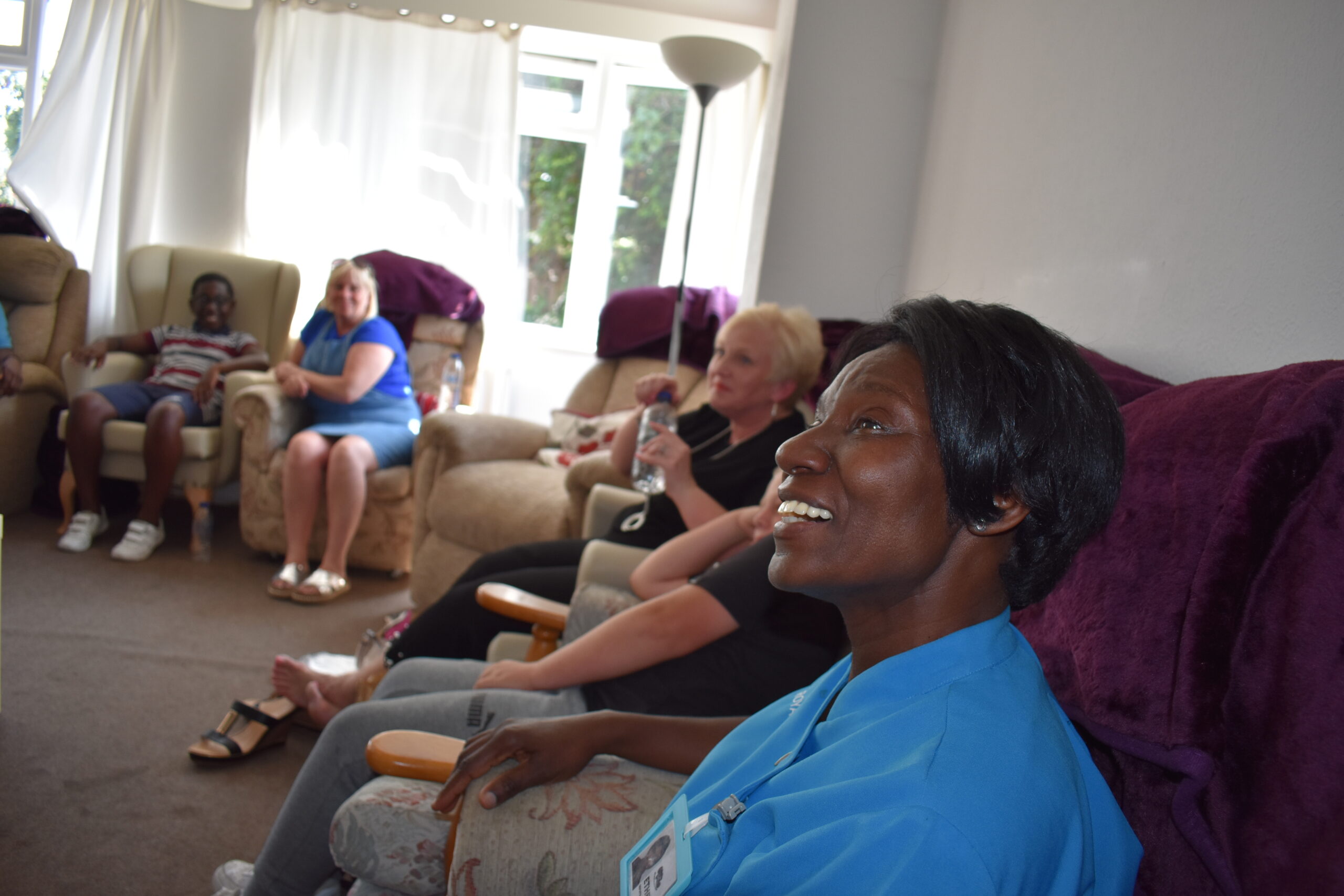 Residents and staff engaging in a common area.