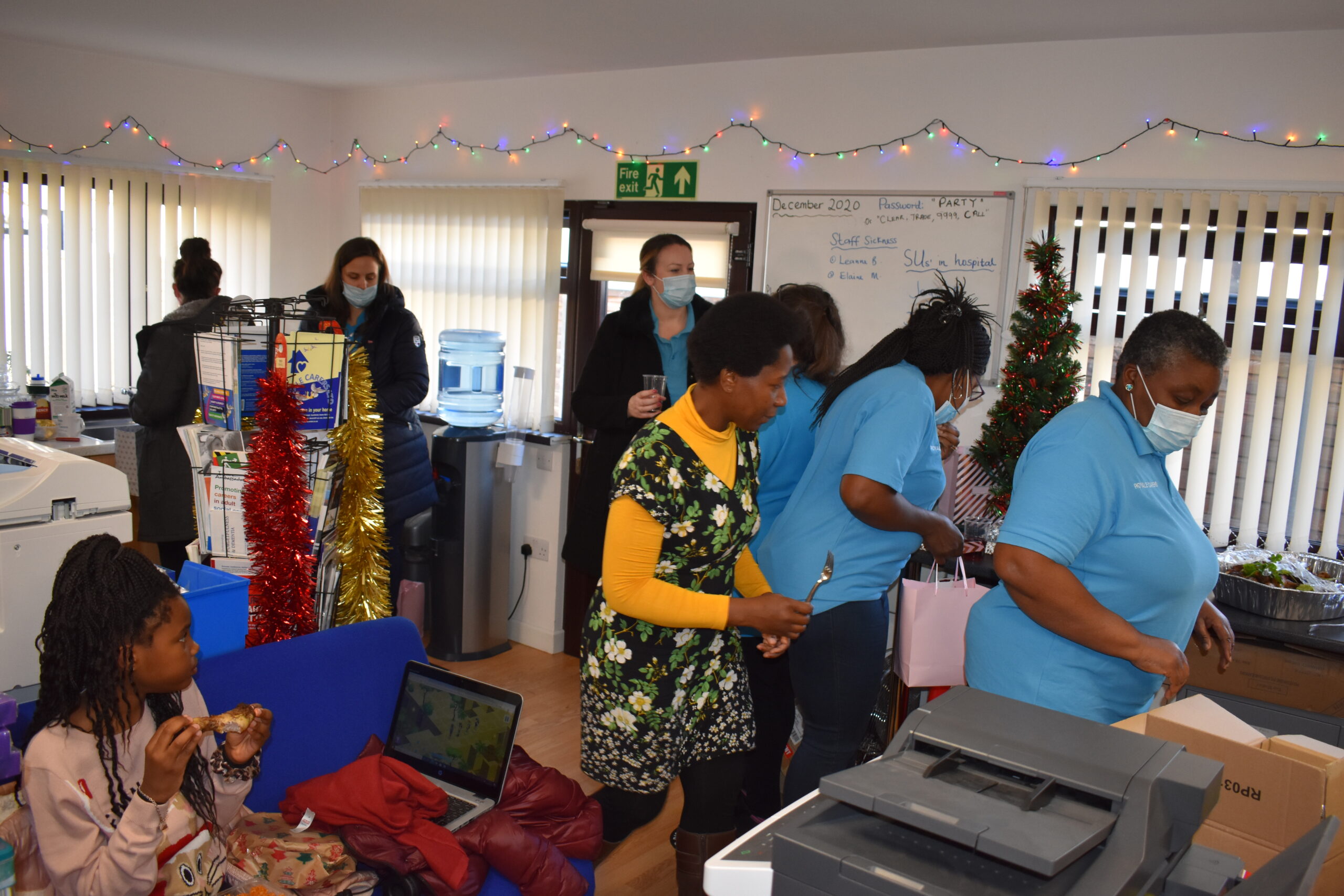 Staff and residents engaging in a social activity in a common area.