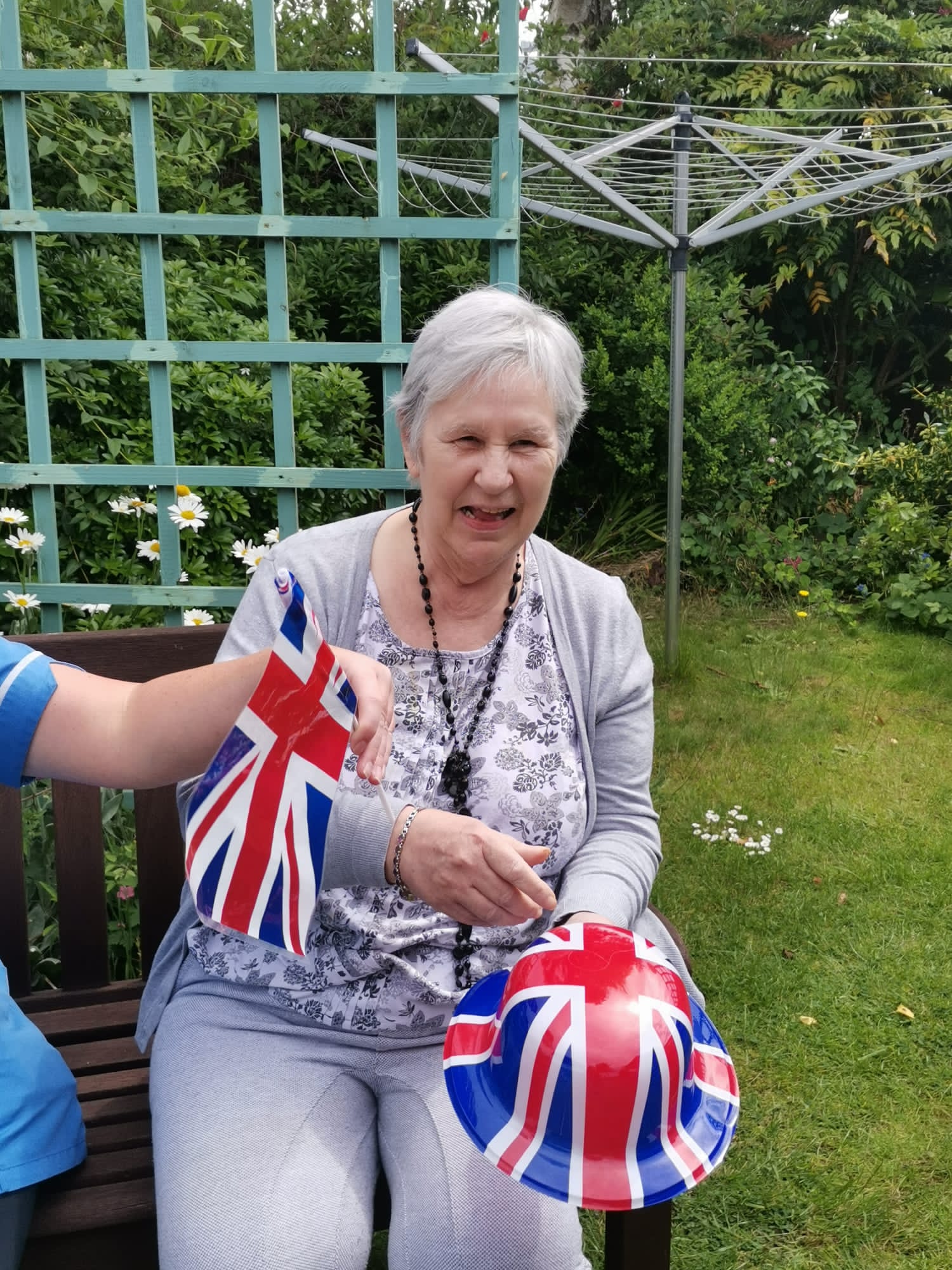 Resident enjoying outdoor activity with flags
