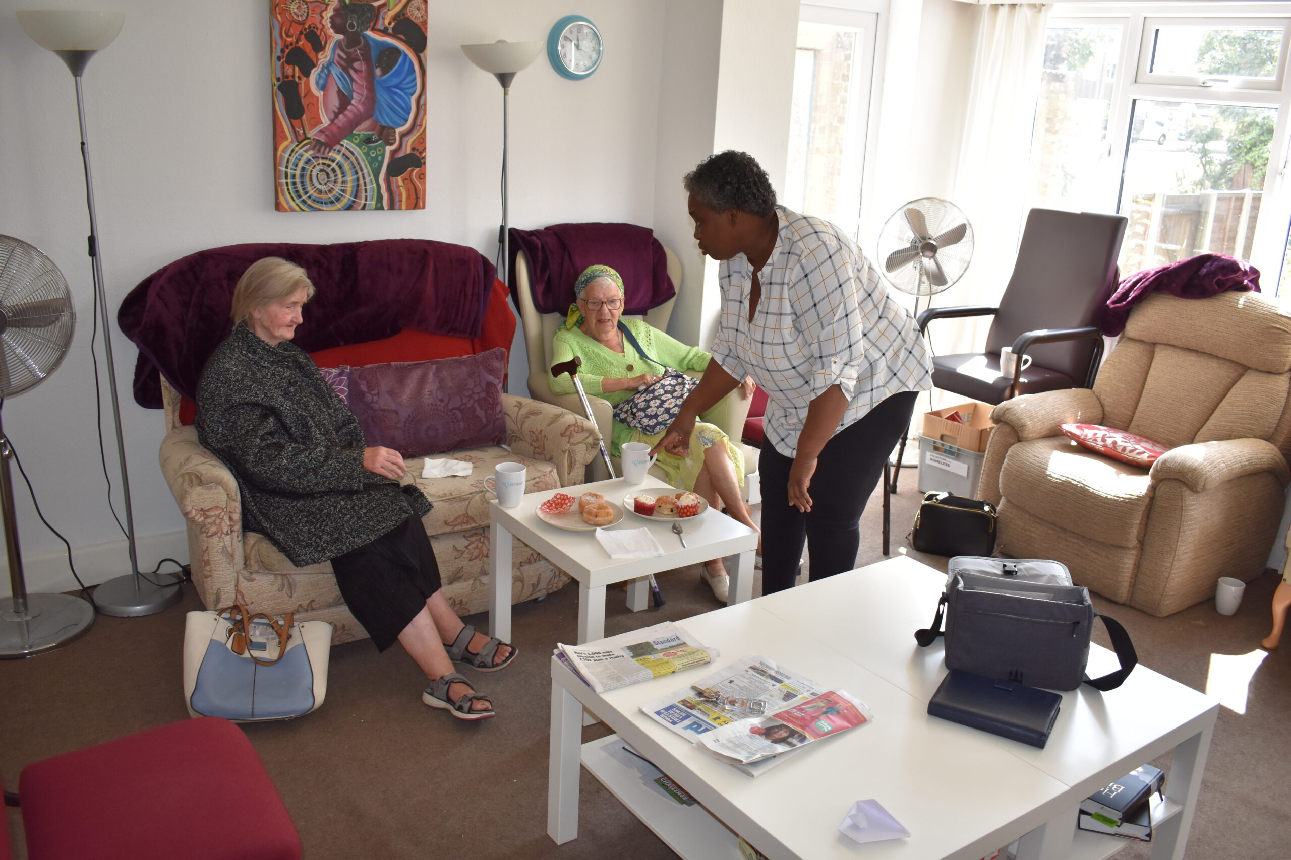 Residents enjoying snacks in a living room.