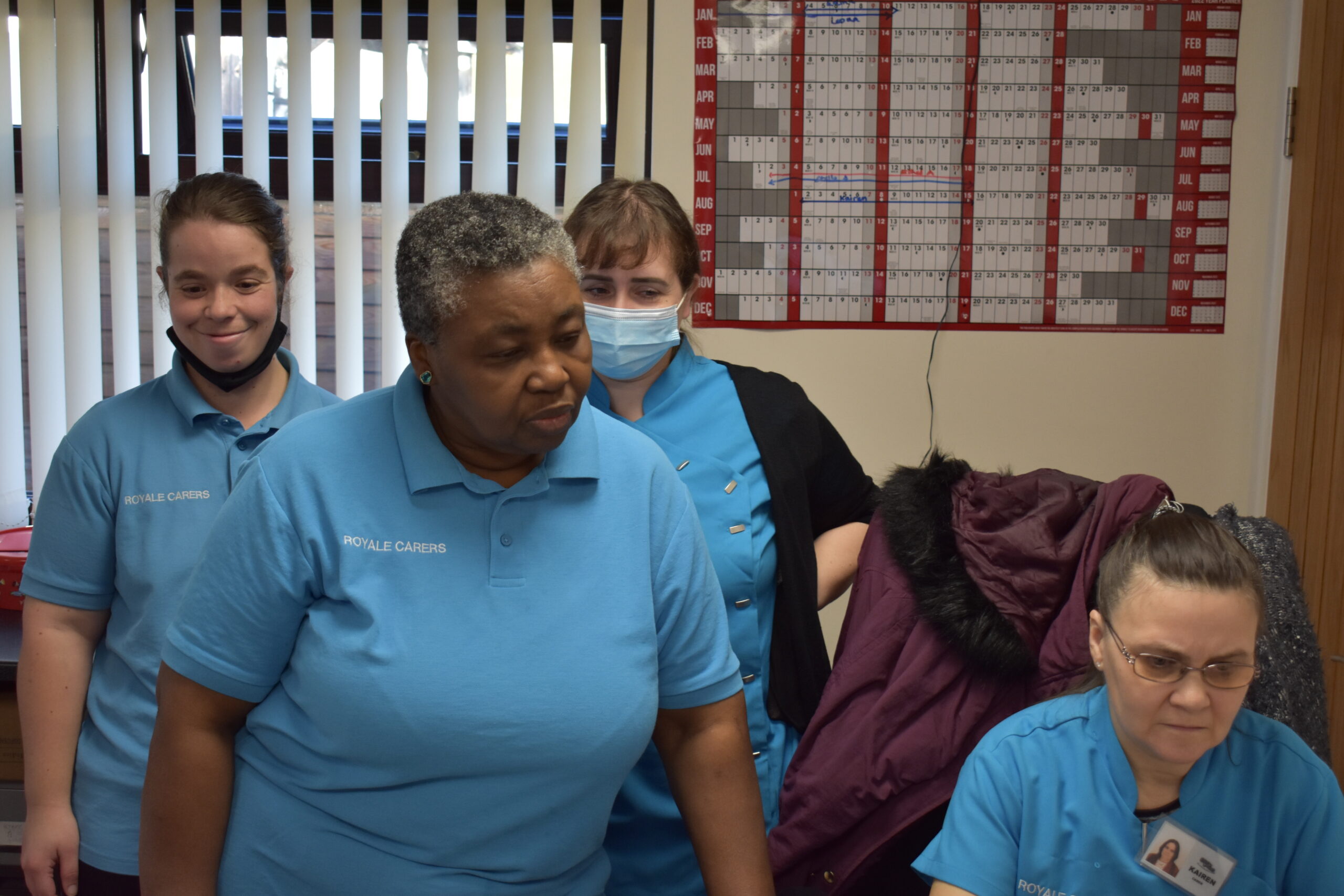 Staff members interacting in a common area.