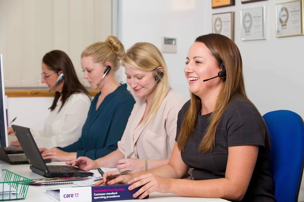 Staff members engaged in a care center environment