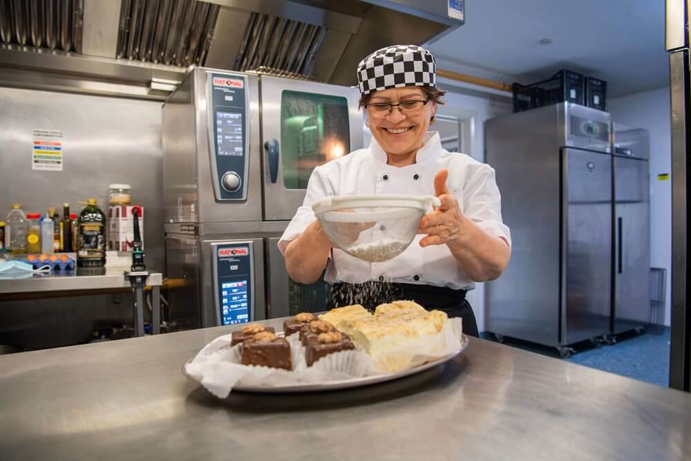 Chef preparing desserts in a kitchen