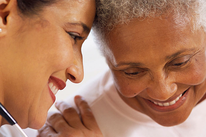 Smiling caregiver and resident sharing a moment