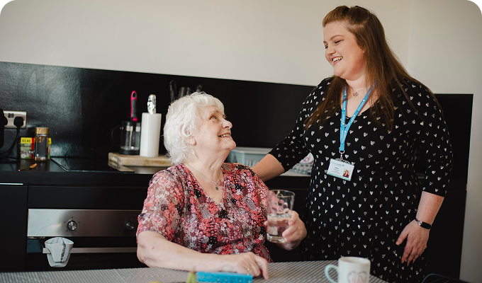 Resident and staff enjoying a moment together
