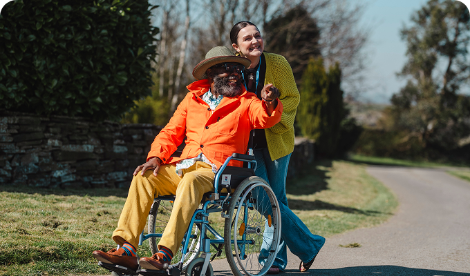 Resident enjoying time outdoors with a staff member.