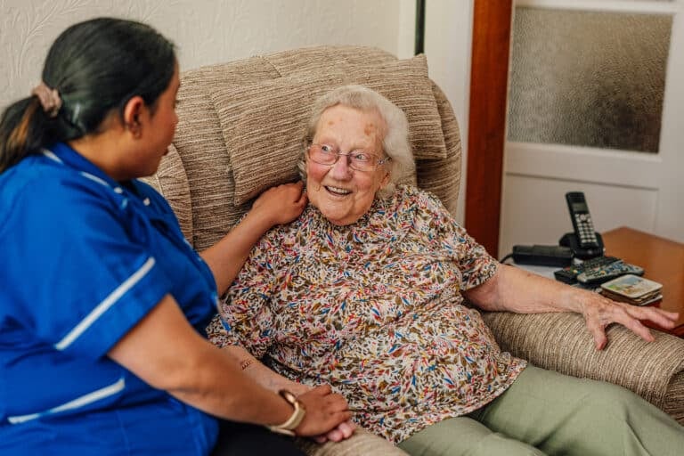 Caregiver interacting with a senior resident