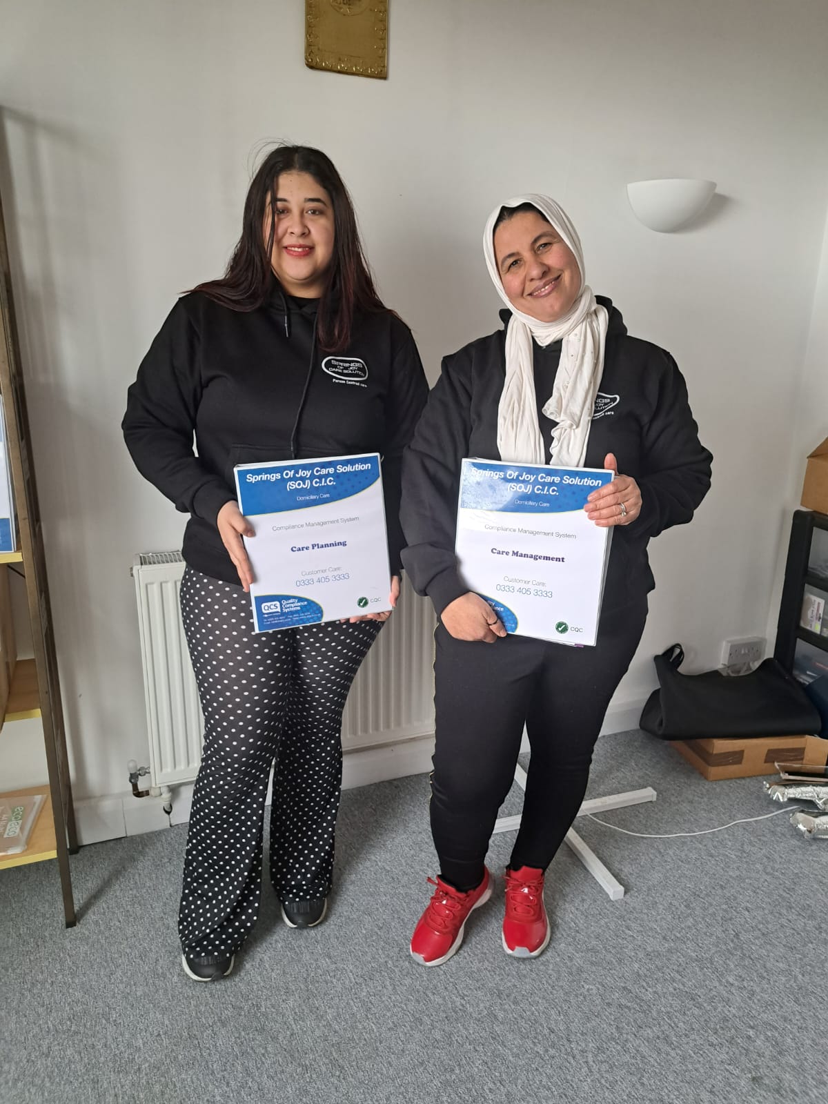 Staff members holding care service certificates