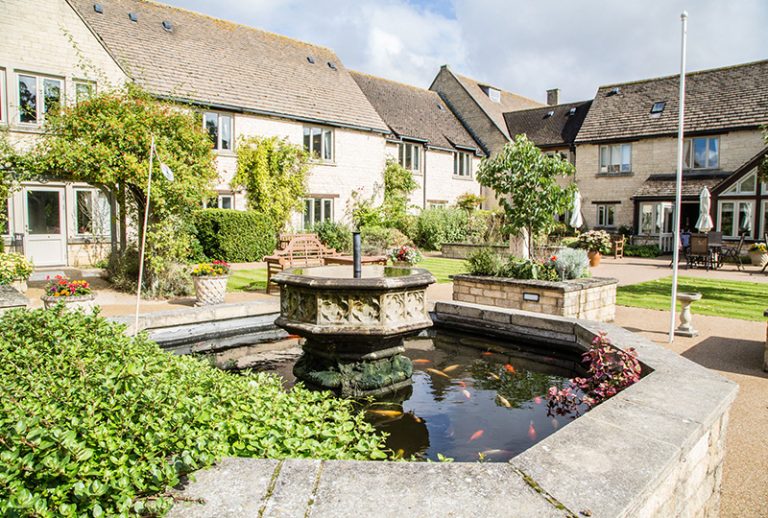 Beautiful garden area with fountain and seating