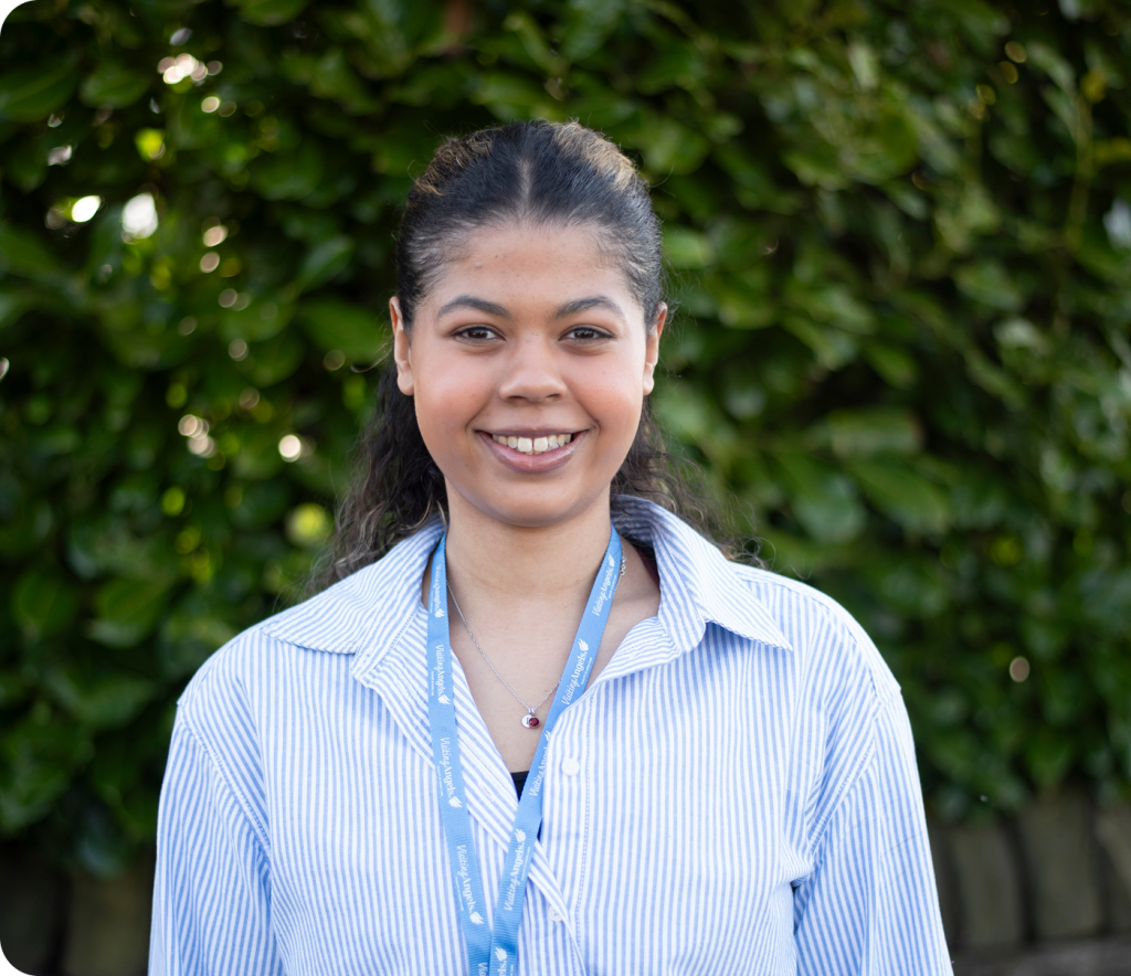 Staff member smiling in an outdoor setting