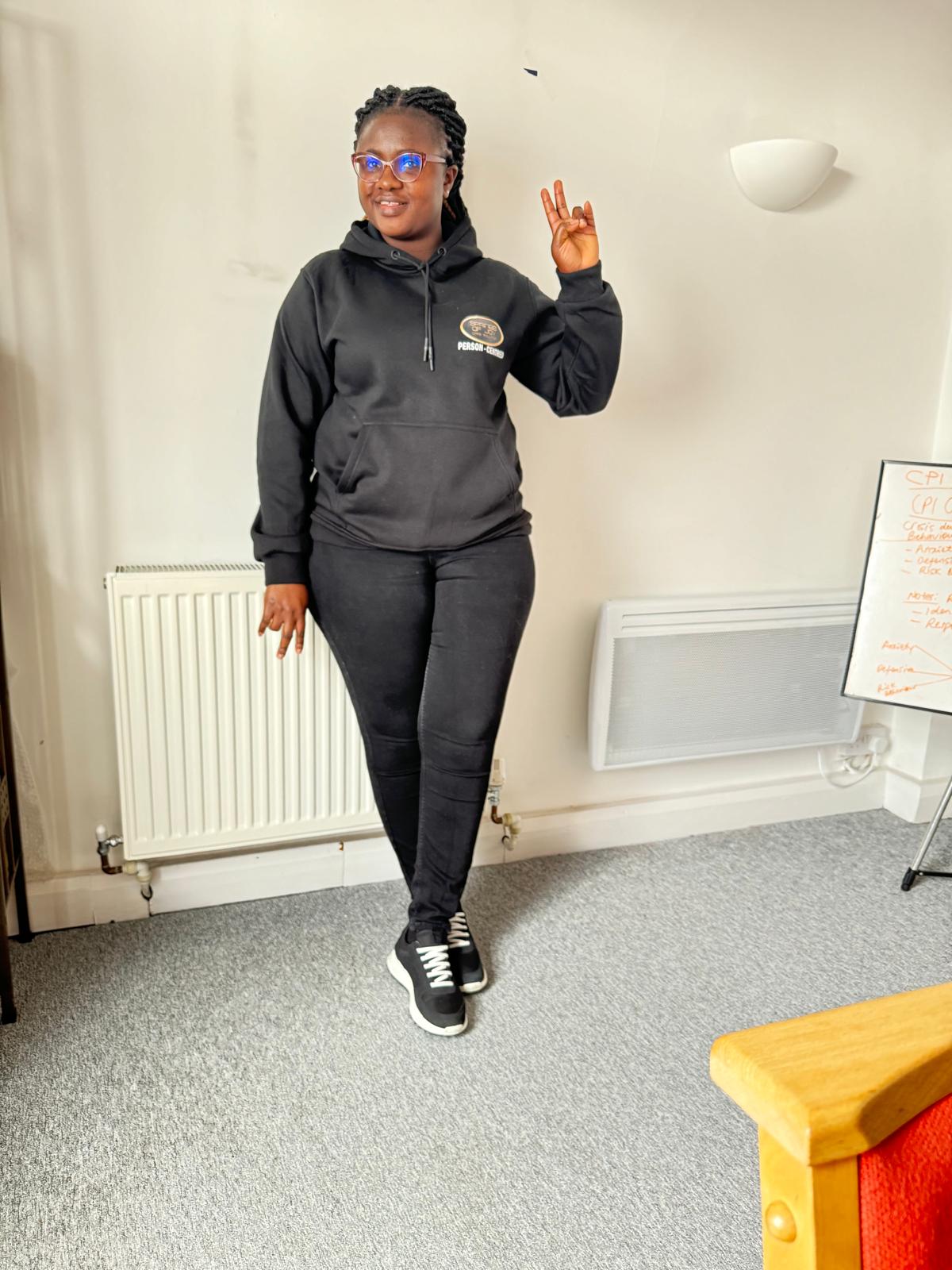 Staff member posing in facility interior.