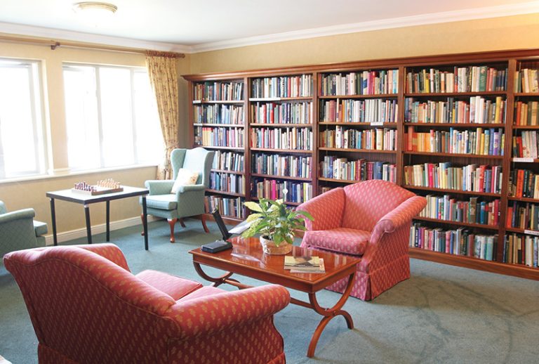 Cozy library with bookshelves and seating.