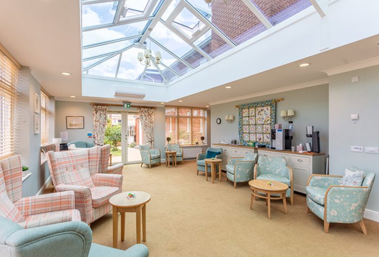 Bright common area with seating and natural light.