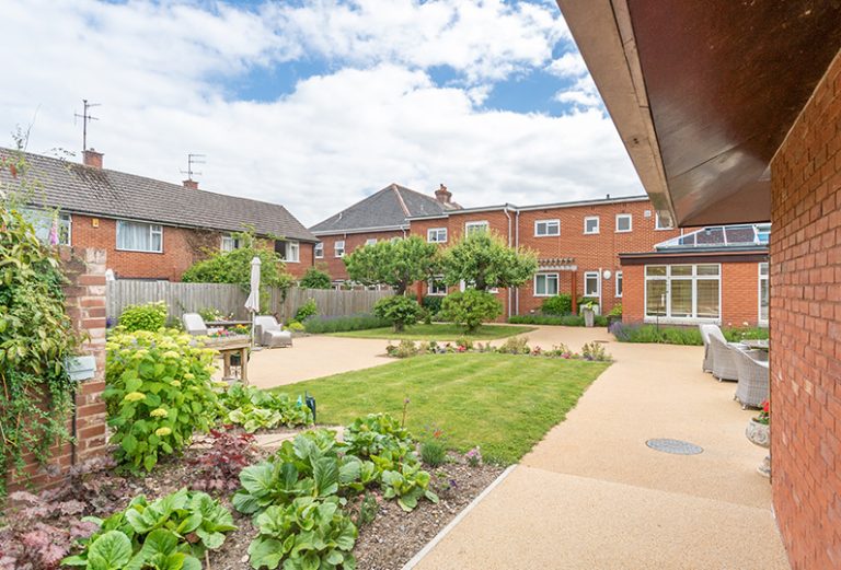 Outdoor garden area with seating and landscaping