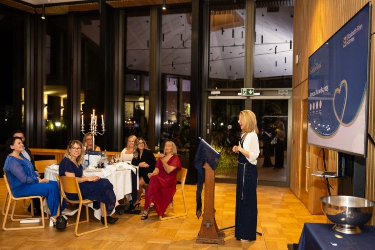 Guests enjoying an event in a common area.