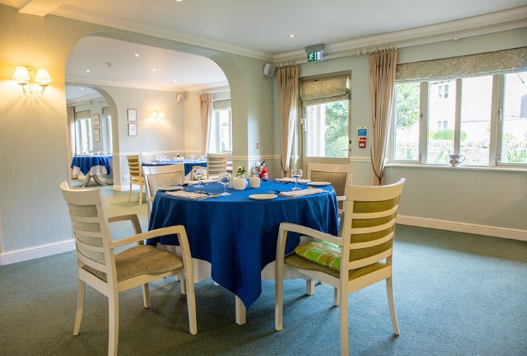 Dining area with tables set for a meal