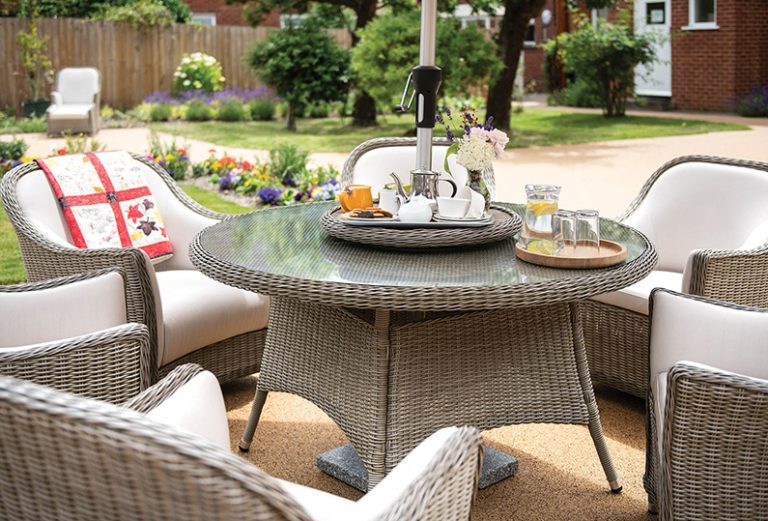 Outdoor seating area with a table and chairs.