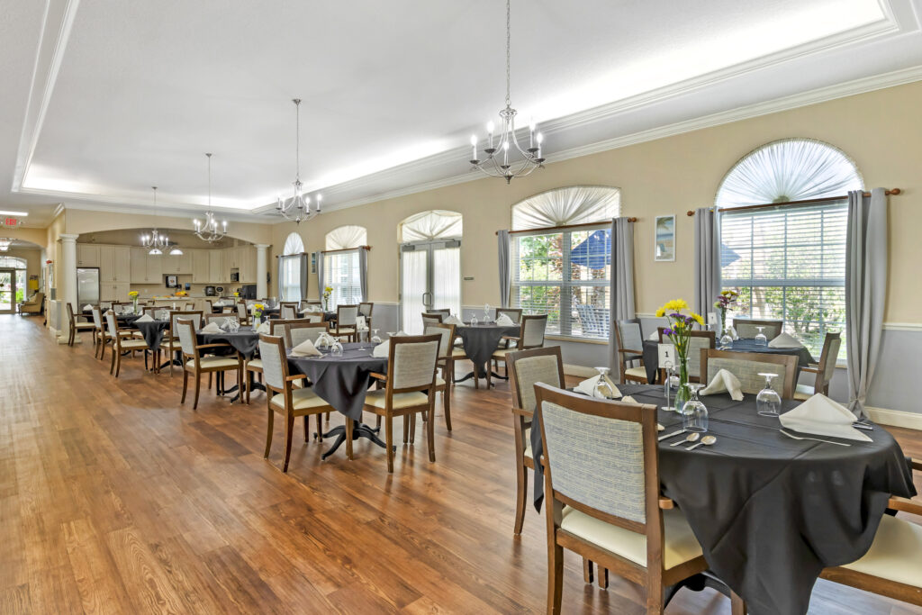 Dining room setup with tables and chairs.