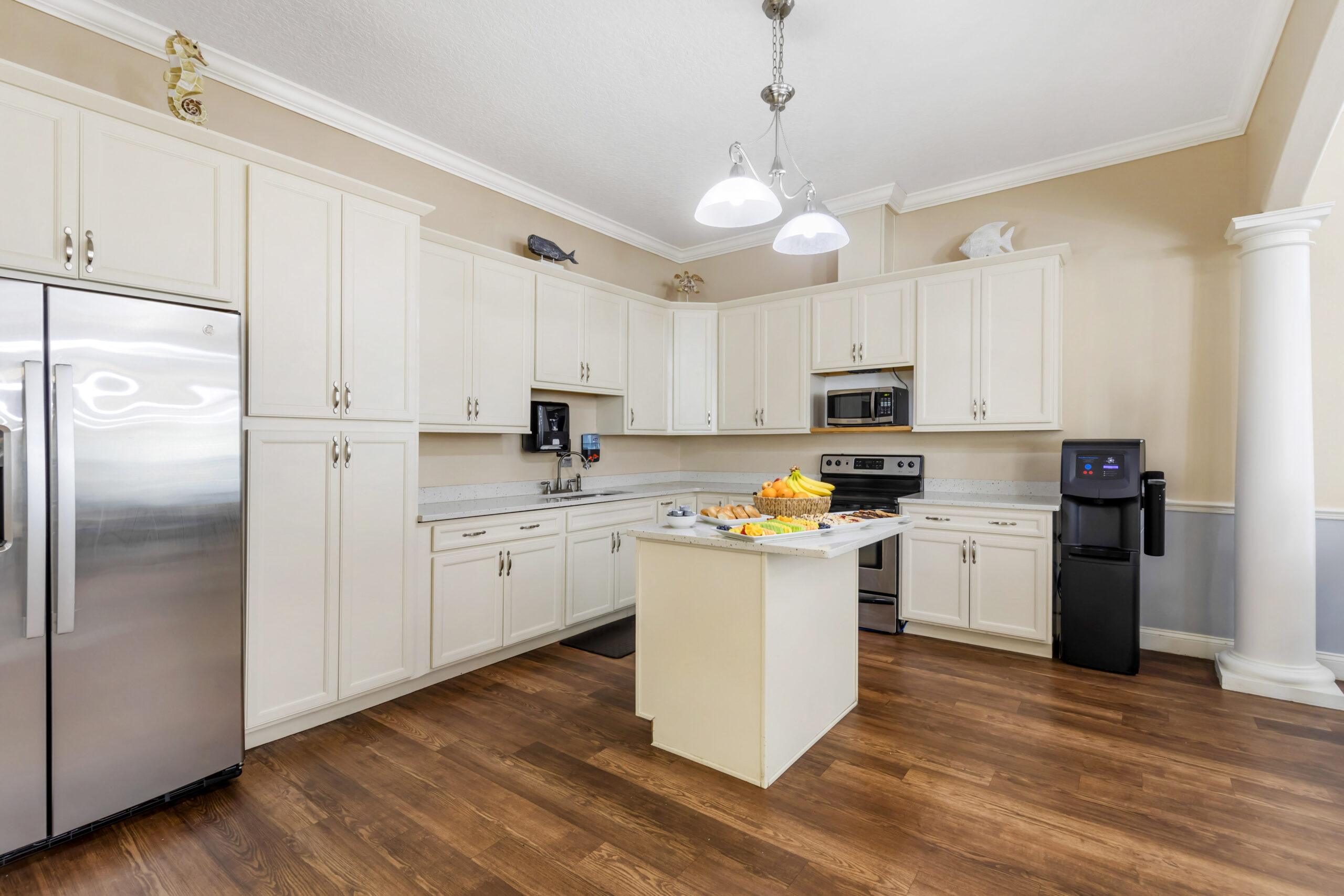 Bright kitchen with fruit and modern appliances