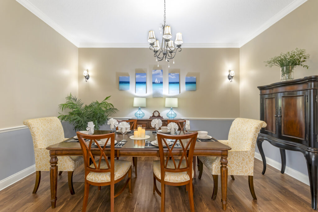 Elegant dining room setup with table and chairs.